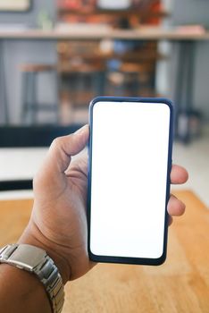 Close up of young man hand using smart phone