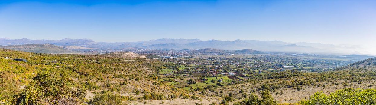 Podgorica, capital of Montenegro: panoramic aerial view. The city is renowned for its green parks. This small country is located on the Balkans peninsula on the Mediterranean, in South Eastern Europe.