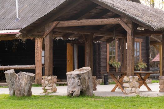 Wooden gazebo standing on the territory near the estate.