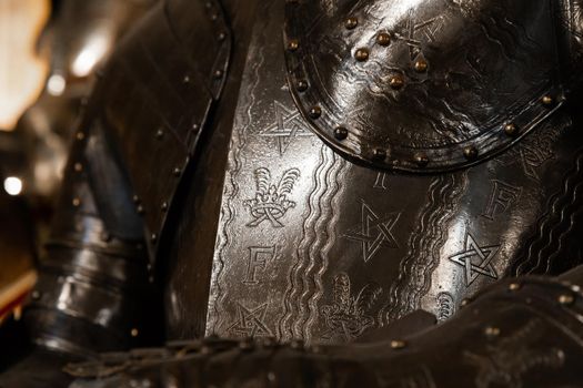 Antique armour on black background. Concept for security, safety and fantasy