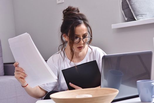 Working from home. beautiful young woman working using laptop while sitting in home office