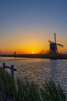 Sunset with windmill Broekmolen, Molenlanden - Nieuwpoort, The Netherlands