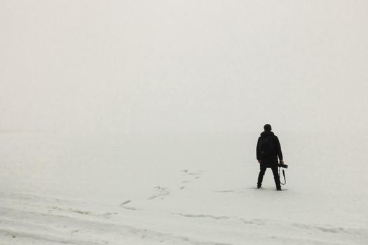 man standing on the ice misty morning simple minimalist photography one person minimalism