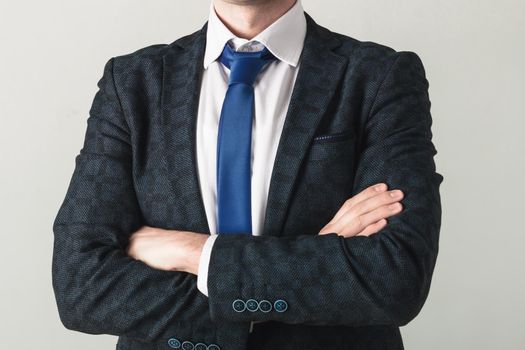 Portrait of a handsome CEO cross hands blue jacket