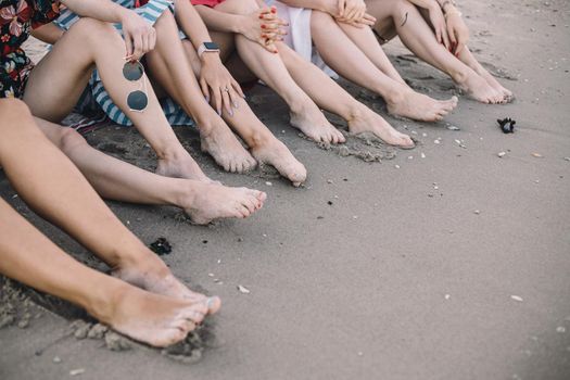 Woman tanned legs on sand beach. Travel concept. Happy feet in tropical paradise