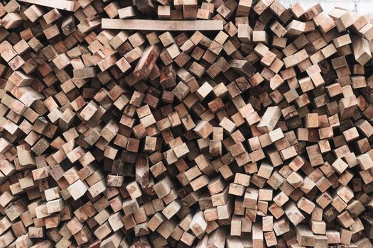 Preparation of firewood for the winter. firewood background, Stacks of firewood in the forest. Pile of firewood.