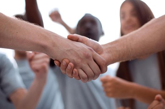 confident group of young men pointing ahead. photo with copy space