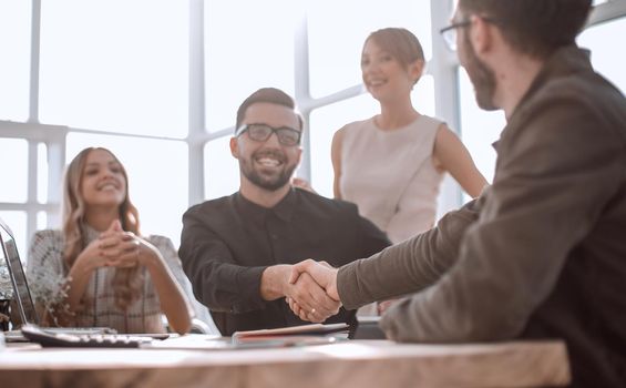 professional young employees sitting together at the office Desk. the concept of teamwork