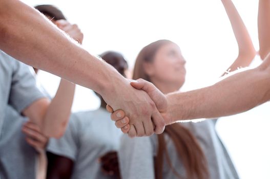 confident group of young men pointing ahead. photo with copy space