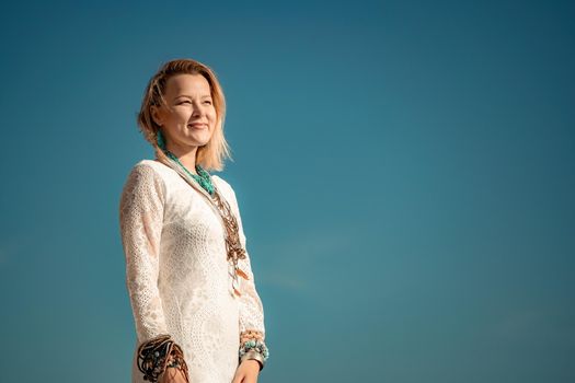 fashionable young model in boho style dress