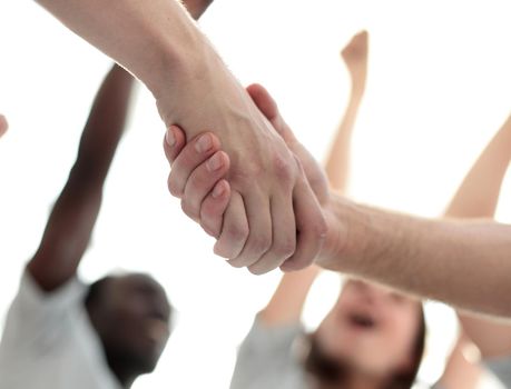 confident group of young men pointing ahead. photo with copy space