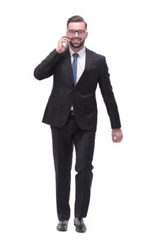 side view. modern businessman talking on mobile phone. isolated on white background