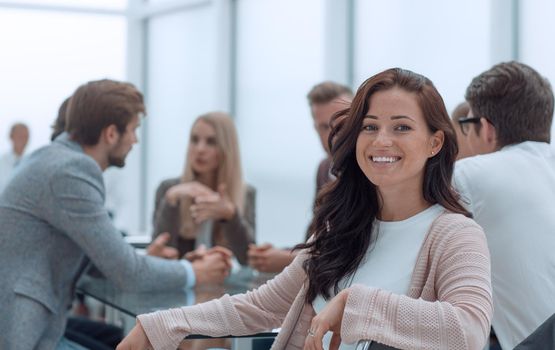 successful business woman sitting in front of a table in a conference room. business concept