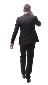 side view. modern businessman talking on mobile phone. isolated on white background