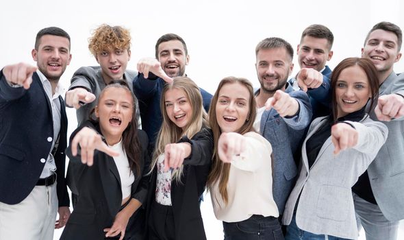 close up . agroup of confident young business people pointing at you. the concept of choice