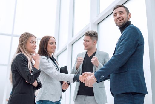 close up. young businesswoman shaking hands with her business partner