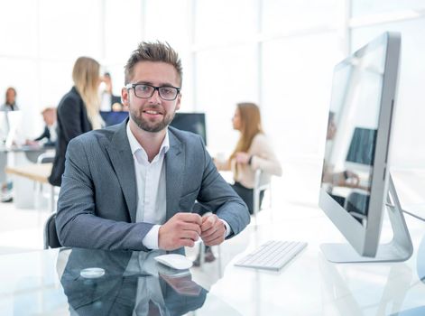 young businessman working on an office computer. people and technology