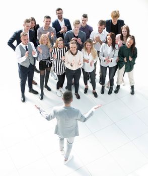 top view. young leader standing at the front of the business team . business concept