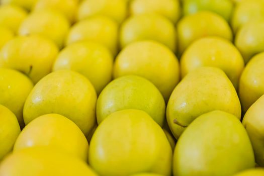 yellow apples packed in cardboard boxes close-up