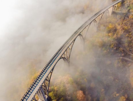 Montenegro. Dzhurdzhevich Bridge Over The River Tara foggy morning.