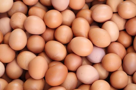 many fresh brown eggs for sale at a market