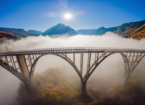 Montenegro. Dzhurdzhevich Bridge Over The River Tara foggy morning.