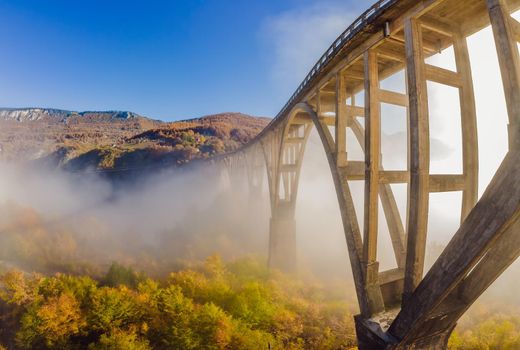 Montenegro. Dzhurdzhevich Bridge Over The River Tara foggy morning.
