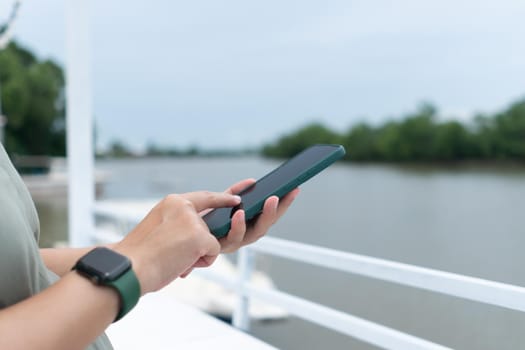 Woman hand using smartphone to do work business, social network, communication concept.