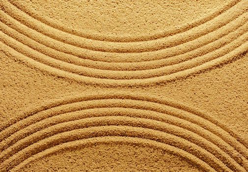 Pattern of smooth abstract lines on the summer sand. Creative minimal concept of tropics or japanese meditation.