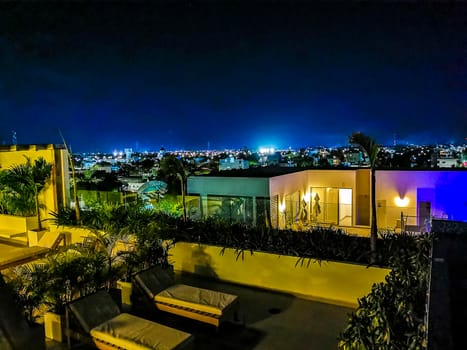 Amazing night cityscape landscape and caribbean ocean and beach panorama view of Playa del Carmen in Quintana Roo Mexico.