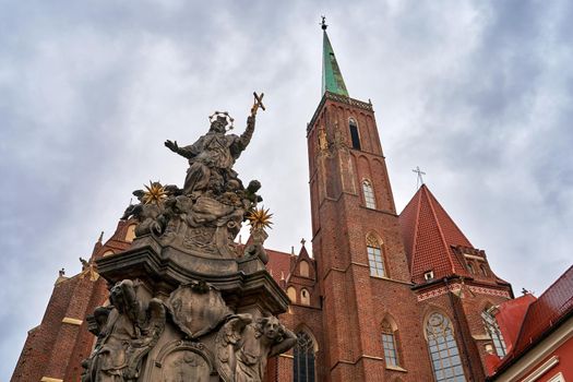 Sculpture of John of Nepomuk in front of the Church of the Holy Cross aka St. Bartholomew's in Wroclaw