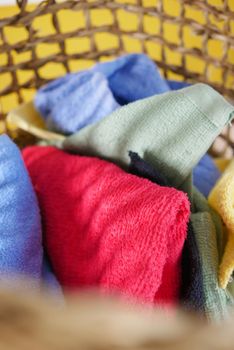 top view of Clothes in basket on floor .