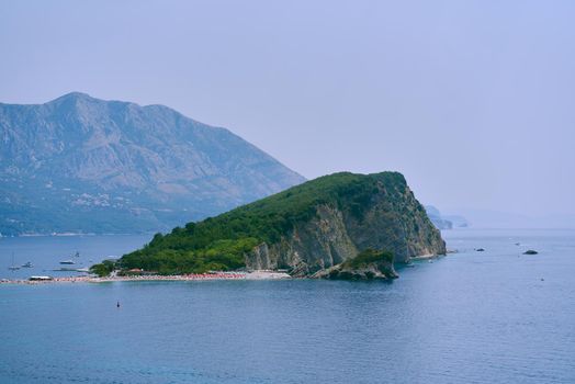 Island in the sea with a beach for tourists in Montenegro.