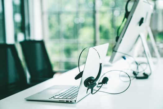 Headset and customer support equipment at call center ready for actively service . Corporate business help desk and telephone assistance concept .