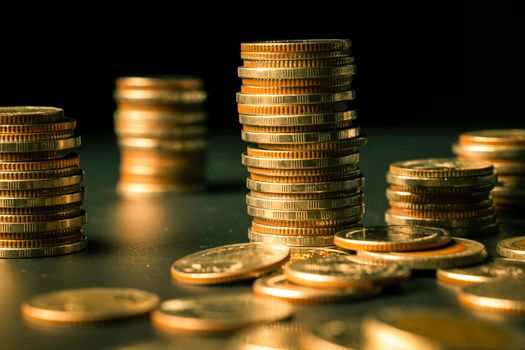Pile of gold coins stack in finance treasury deposit bank account for saving . Concept of corporate business economy and financial growth by investment in valuable asset to gain cash revenue profit .