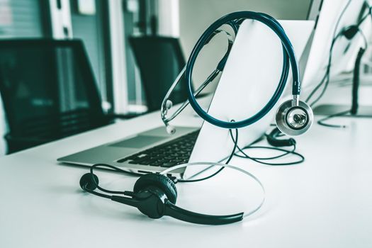 Headset and doctor equipment at clinic ready for actively support for patient by online video call . Concept of telehealth and telemedicine service .