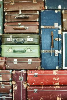 Suitcases for travel. Multicoloured suitcases for clothes. Background. Texture.