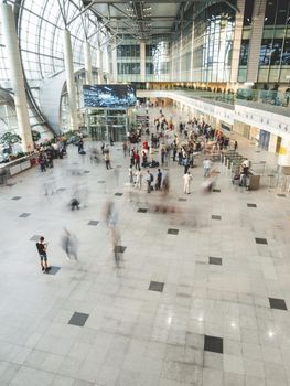 MOSCOW, RUSSIA - June 28, 2021. Moving people on first floor at Domodedovo airport hall. Long exposure.