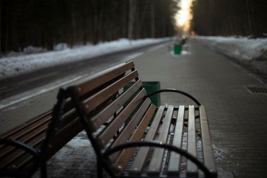 Shop in park. Bench on street. Details of city's park infrastructure. Place to relax.