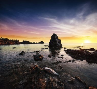Fantastic panoramic view of the rocky coast of the sea in the evening at sunset. Turkey