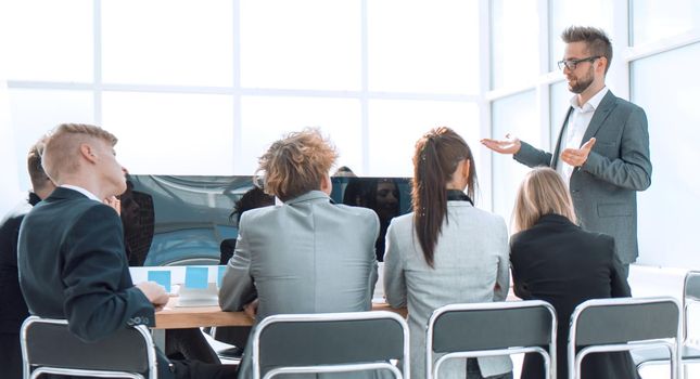 business team applauding the boss at a work meeting. the concept of teamwork