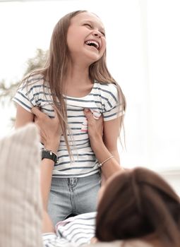 close up.happy mom and daughter spend their free time together.the concept of children's happiness