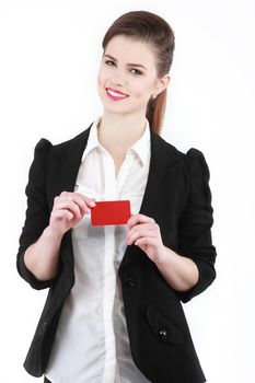 Close-up portrait of young smiling business woman holding credit card isolated on white background