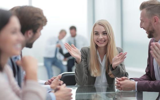 young business woman discusses her ideas with a business team. the concept of teamwork