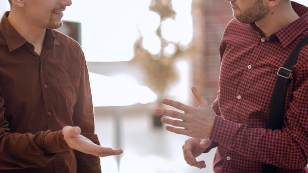 closeup.two colleagues talking in office