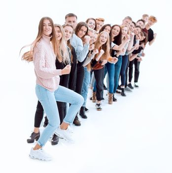 confident young woman standing in front of a column of young people . photo with copy-space