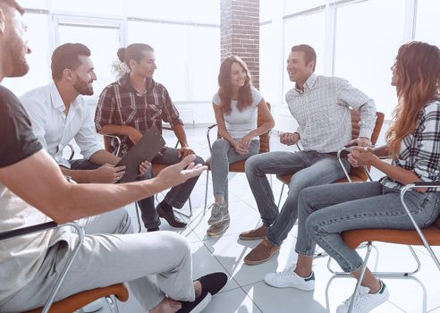 successful employees sitting in class for team building