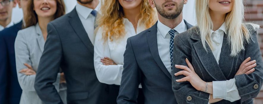 group of young business people standing in a row.the concept of teamwork