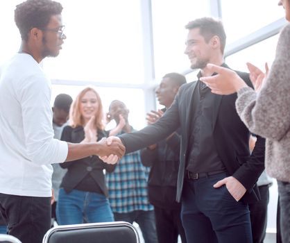 group of happy young people applauding their leaders. the concept of success