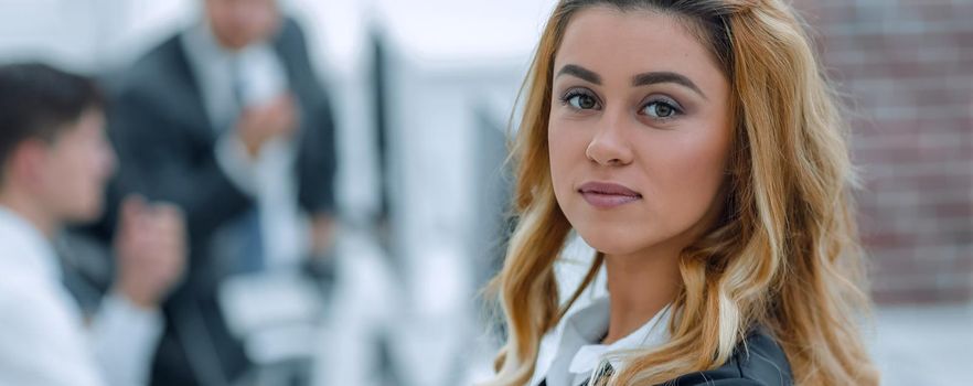 portrait of pensive business woman on the background of the office